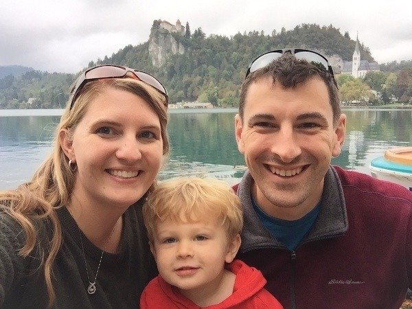 Slovenia is on the list of best places to visit with toddlers. This photo is a toddler and his family enjoying at Lake Bled, Slovenia