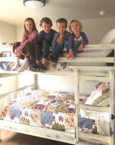 Kids on a bunkbed at a private Angel Rock Rentals in Moab.  Kids love this place to stay in Moab
