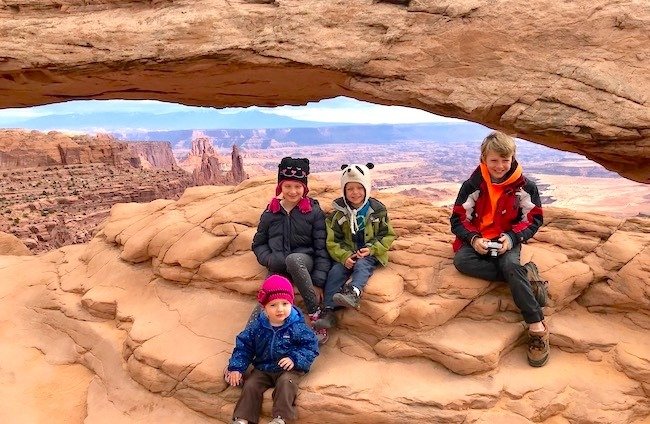 Toddler and big kids at Mesa Arch Canyonlands National Park