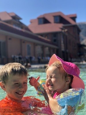 Glenwood Springs Hot Springs Pool - Kids playing in the worlds largest hot springs pool.  You can splash and have fun in the warm water.