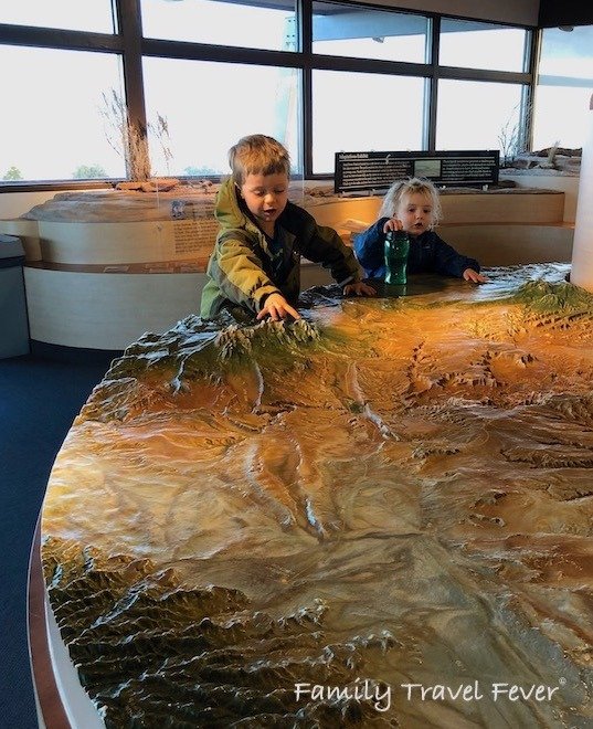 The Visitor Center is one of the best things to do at Dead Horse Point State Park. Kids playing with Visitor Center exhibit