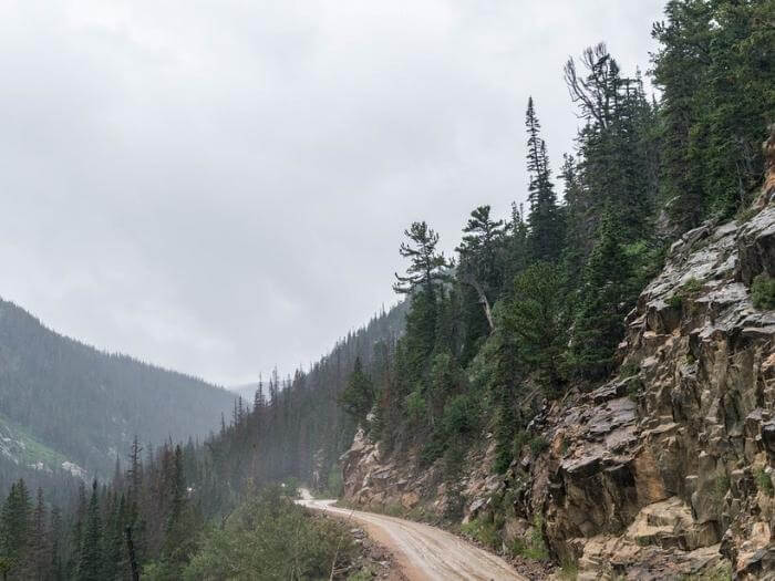 A scary mountainside road in the Old Fall River Road in Colorado.