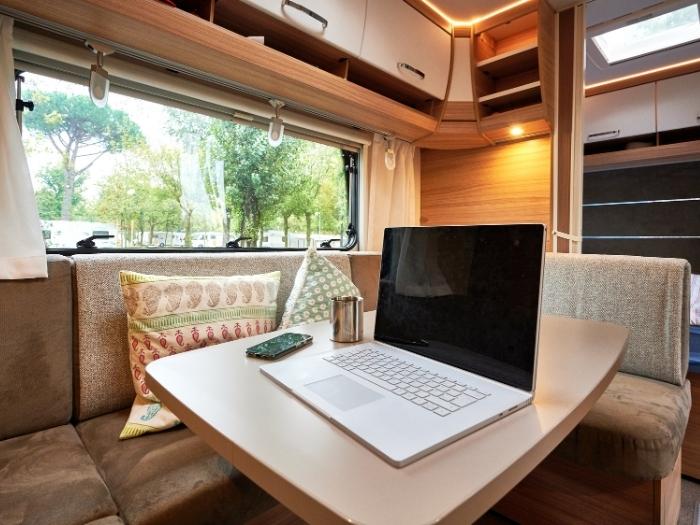 A laptop on an RV dining room