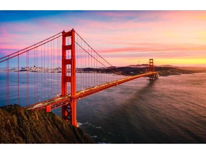 A view of San Francisco bridge with a sunset