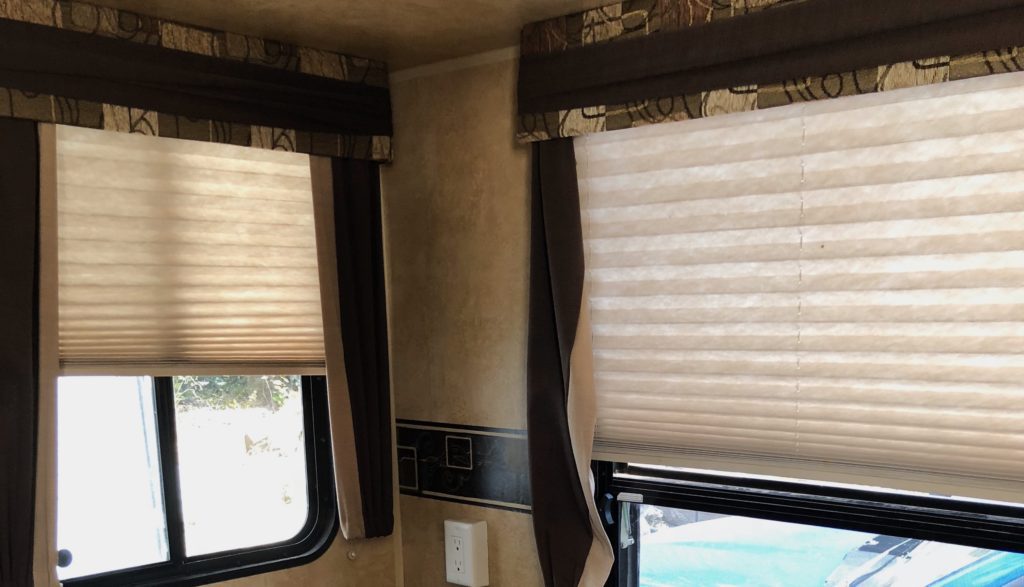 An RV window with blinds