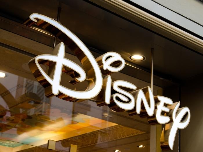 Disney logo in white with golden lining