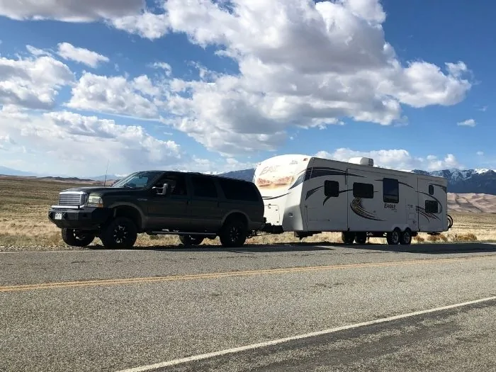An SUV pulling a fifth wheel