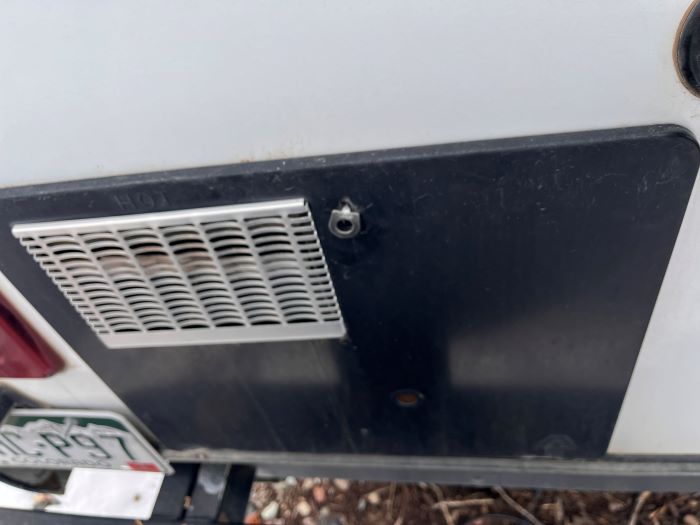 RV Furnace Panel Access and Vent on Exterior End of Camper