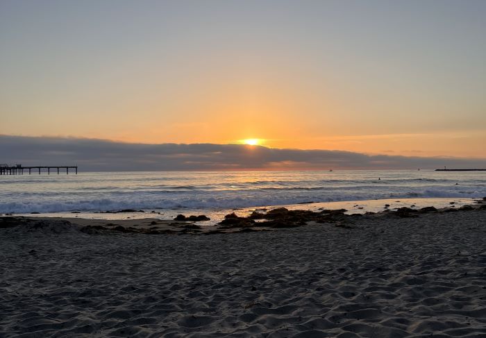 The sun sets over the Pacific Ocean in San Diego, California