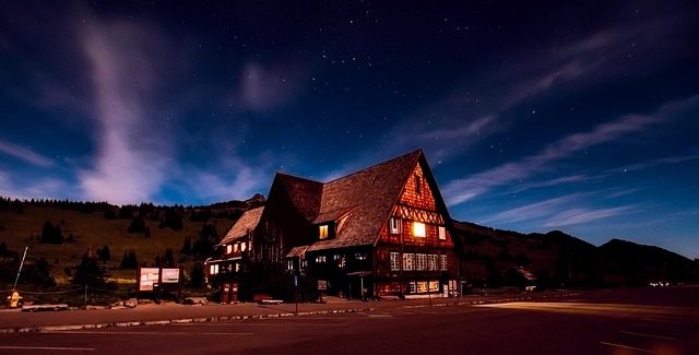 Historic mountain lodge resort at sunset with dramatic sky