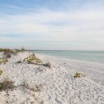 White sand beach with clear blue-green water on the Gulf Coast of Florida