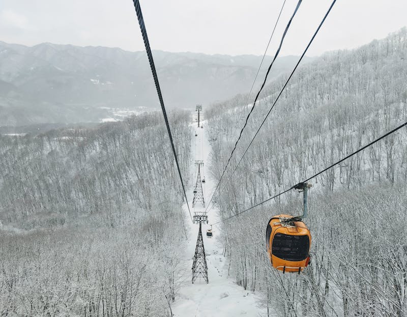 Cable car over snow-covered forests in Hakuba Nagano Japan