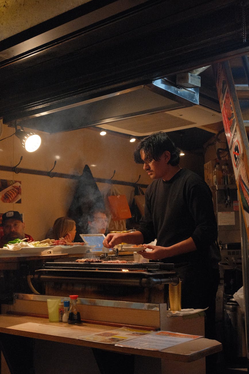Japanese street food vendor grilling at night in Japan