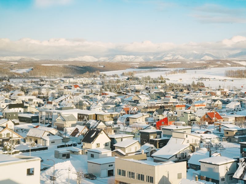 Aerial view of a snow-covered village in Hokkaido Japan