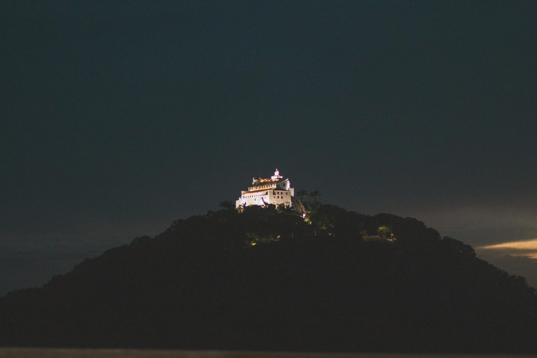 Illuminated Shuri Castle on a hill at night in Okinawa