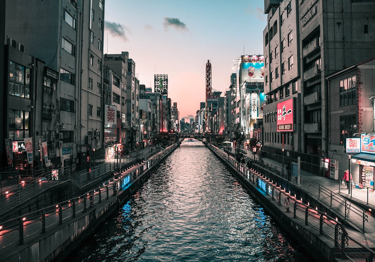 Dotonbori Canal in Osaka Japan at twilight with city lights
