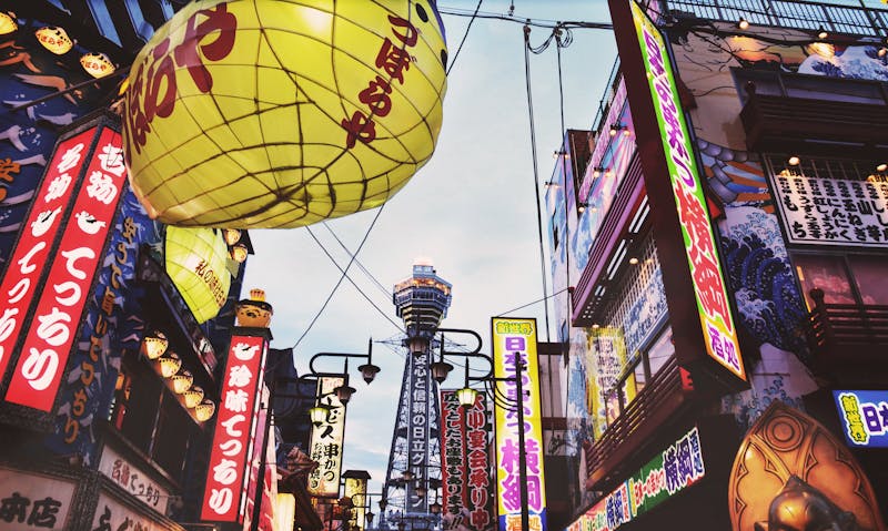Colorful neon lights on a bustling street in Osaka