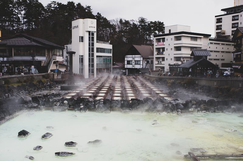 Hot spring town with steam rising