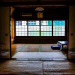 Traditional Japanese ryokan room with tatami flooring and sliding doors