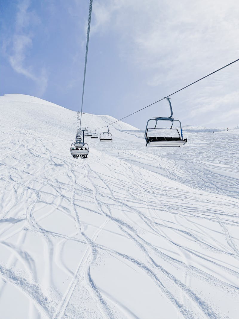 Ski lift over pristine snow-covered slopes