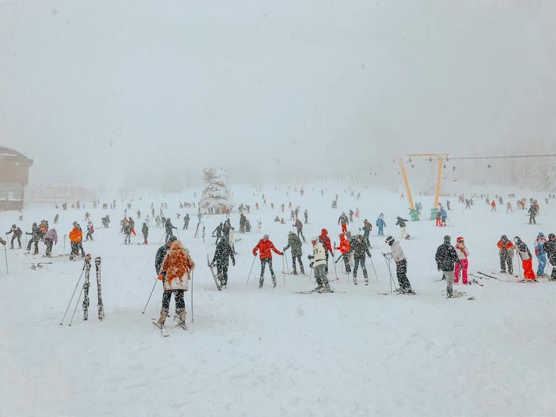 Skiers enjoying snowy slopes at a winter resort