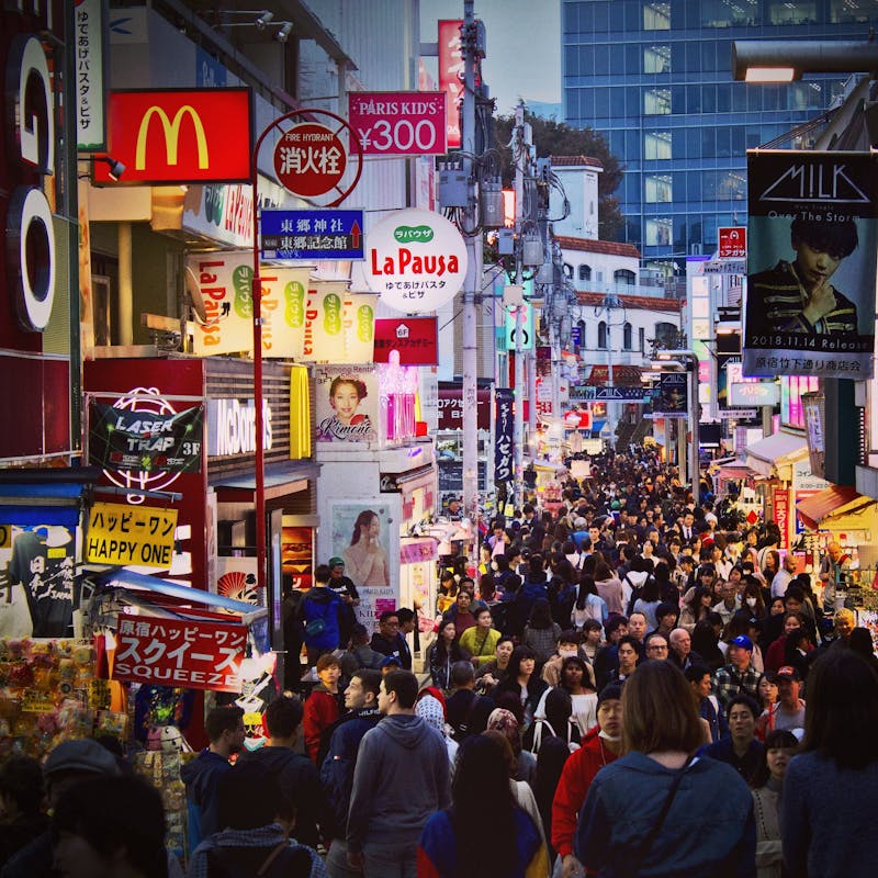 Crowded Takeshita Street in Harajuku Tokyo at twilight