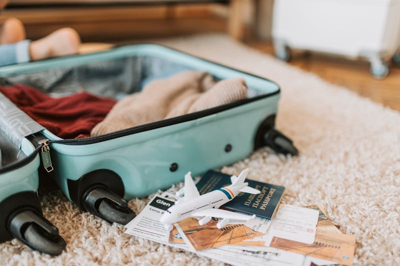 Suitcase with passport and travel essentials