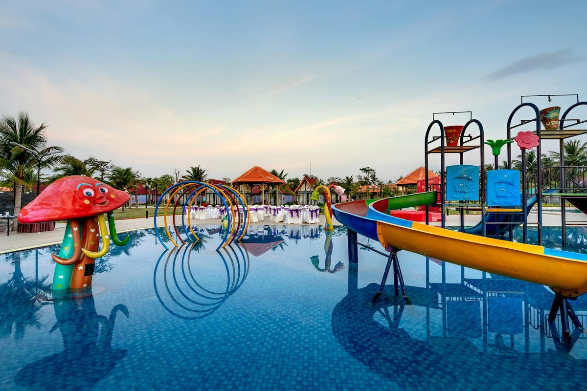 Colorful waterslides at a resort pool area