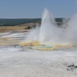 Old Faithful geyser erupting in Yellowstone National Park