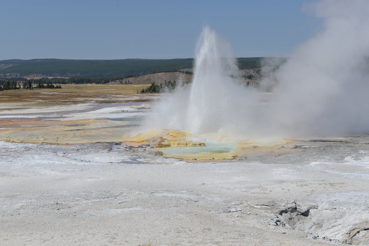 Old Faithful geyser erupting in Yellowstone National Park