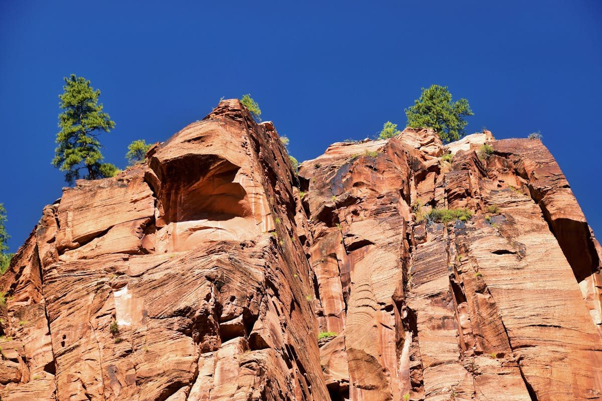 Red sandstone cliffs under blue sky at Zion National Park