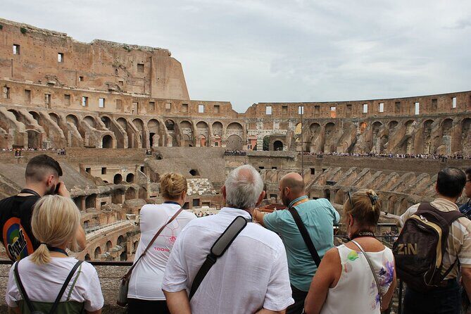 Colosseum and Palatine Hill: Unveil Rome’s Ancient Spectacles - Entering the Colosseum with reserved timing and a guide’s map