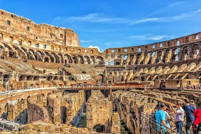 Colosseum with Arena & Roman Forum Guided Tour - Entering the Colosseum: the arena door and the Flavian Amphitheater story