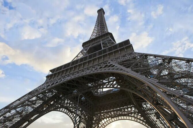 Eiffel Tower Climbing Tour with Summit Access - First Floor Stop: A Smaller Crowd Feeling (and Better Bearings)