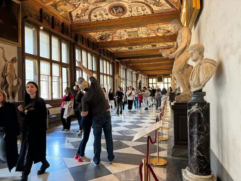 Florence: Uffizi Skip-the-Line Ticket & Digital Audio Guide - Finding Your Host: Leonardo Statue, ENJOY ROME Flag, Voucher Exchange