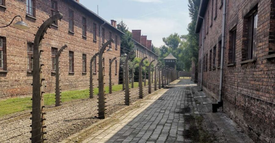 From Krakow: Auschwitz-Birkenau Camp Complex Guided Day Trip - Auschwitz I: The Gate, the Barracks Story, and the First Shock of Scale
