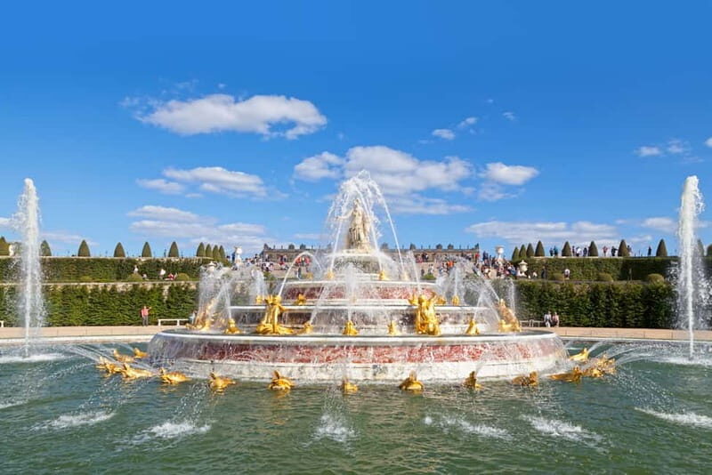 From Paris: Versailles Palace Guided Tour with Bus Transfers - The gardens: 1,800 acres of walking, statues, and showtime options