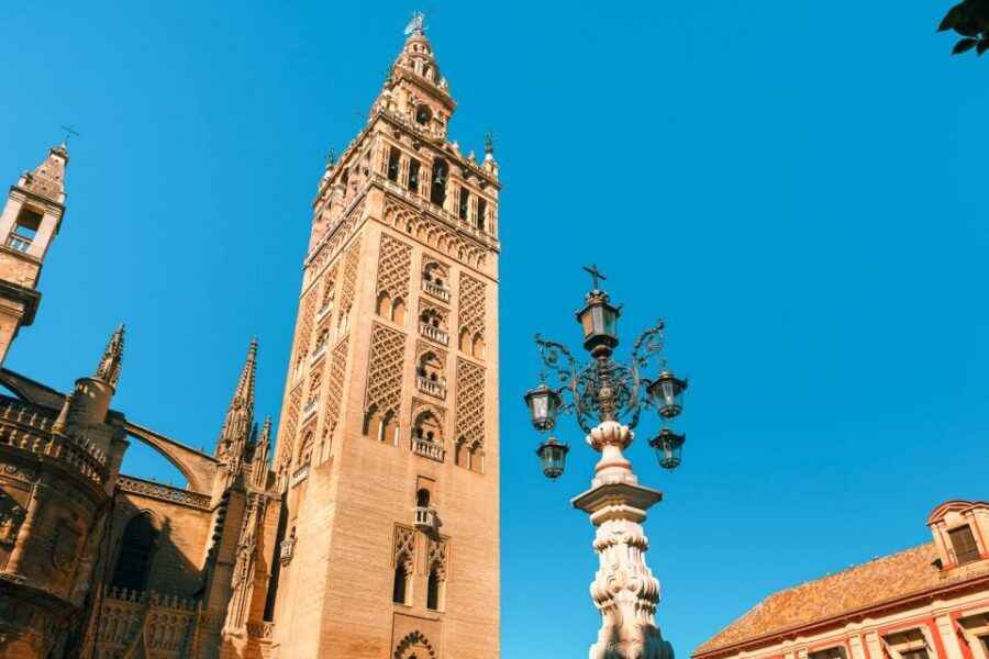 Seville: Alcázar, Cathedral & Giralda Fast Track Guided Tour - Royal Alcázar: Mudejar Palace, Gothic Palace, and that stucco courtyard glow